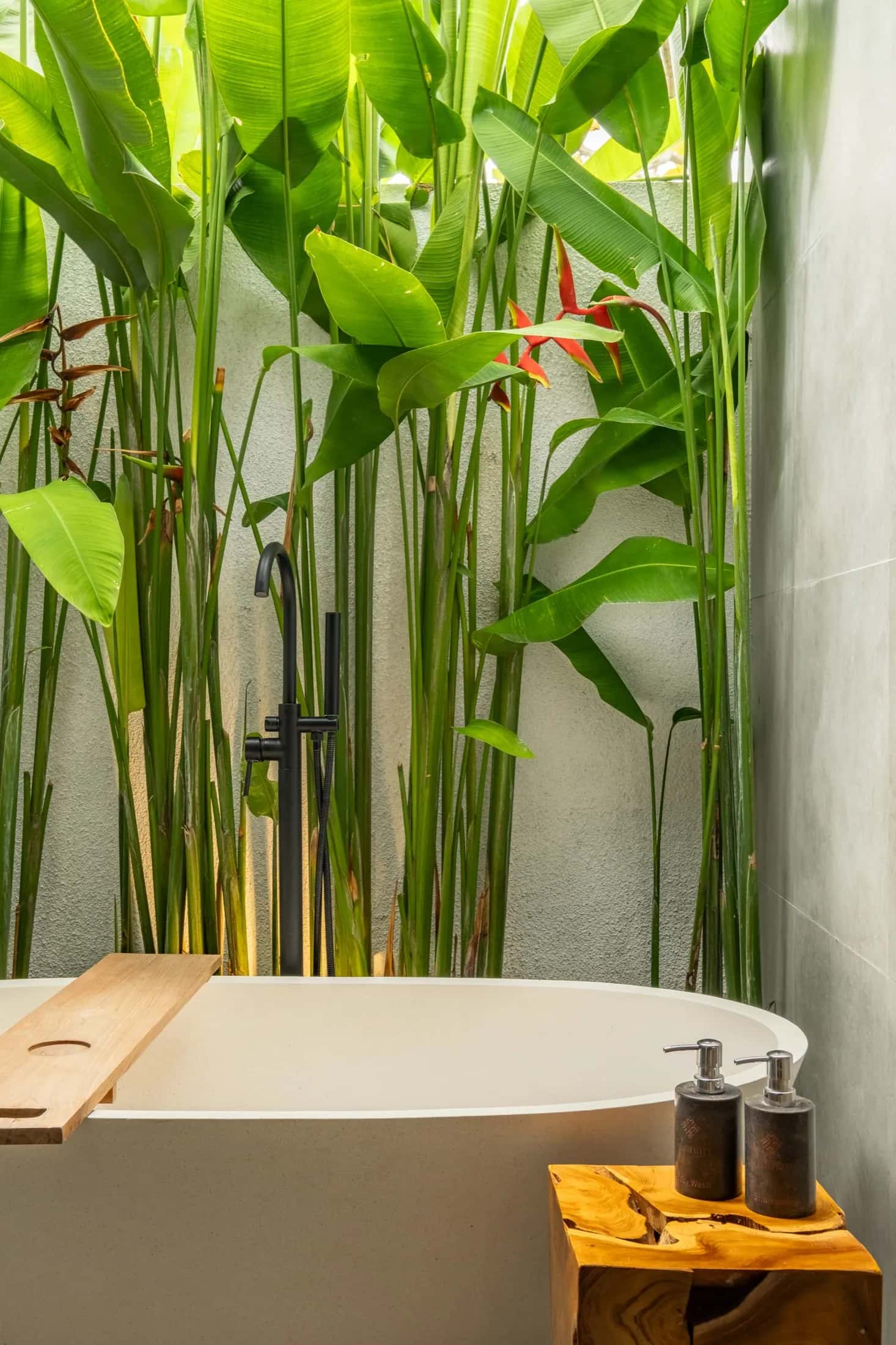 One Bedroom villa freestanding bathtub surrounded by lush tropical garden
