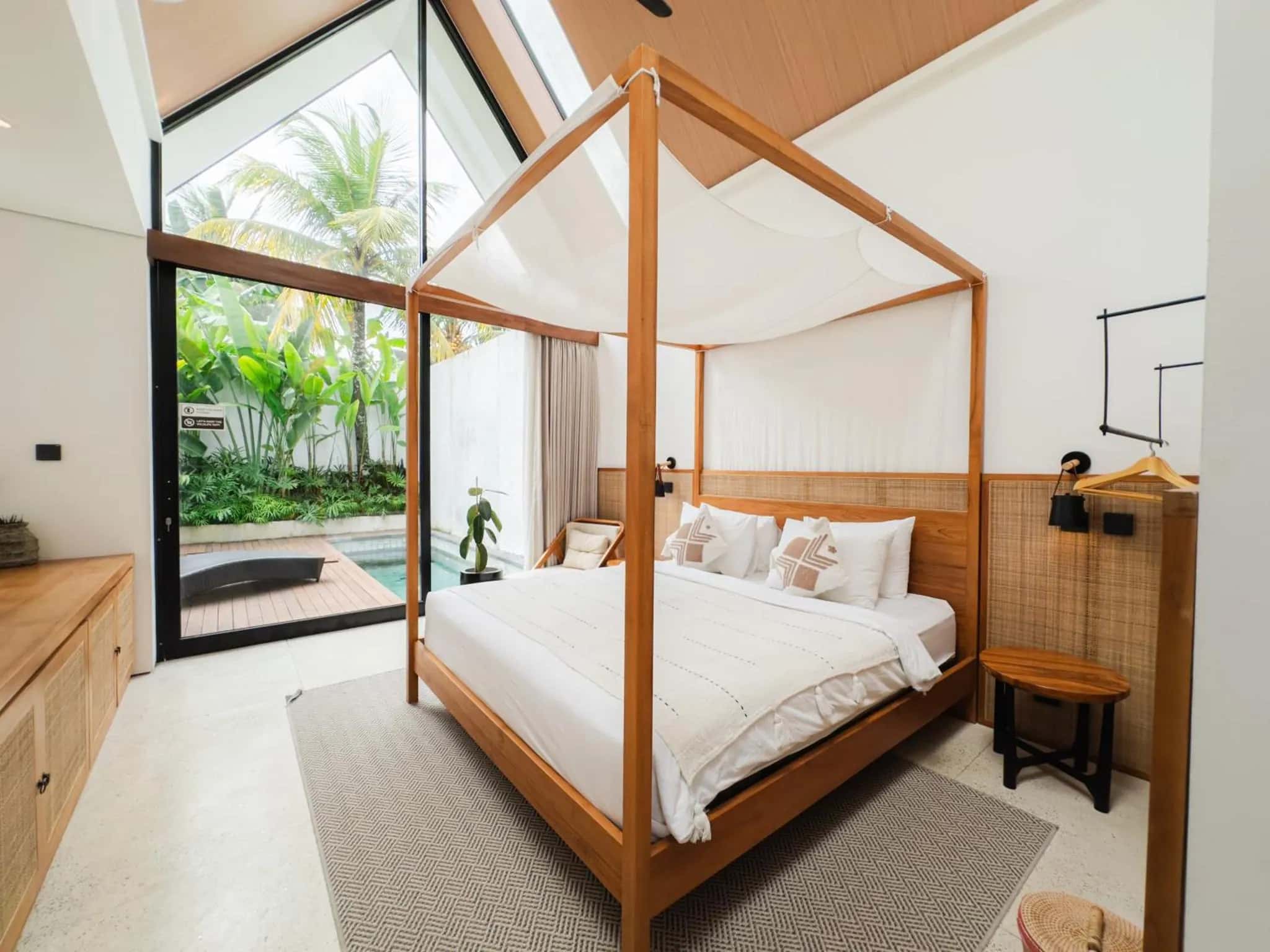 One Bedroom bedroom with a canopy bed and a large window