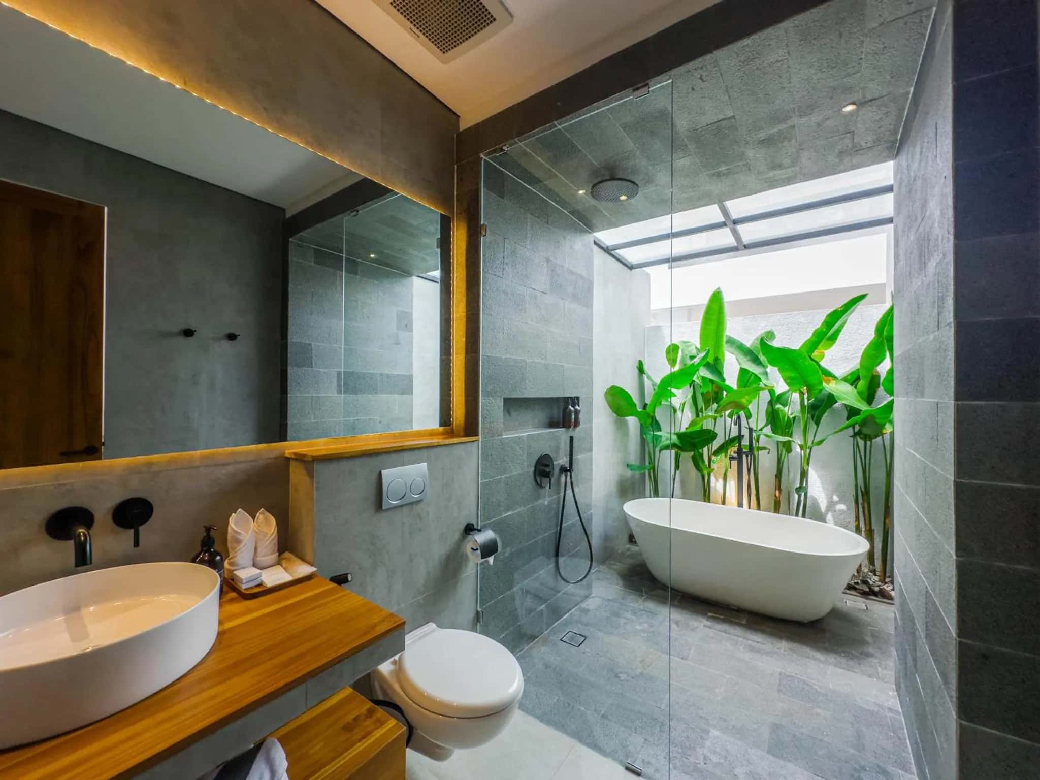 One Bedroom bathroom with a white tub and a sink