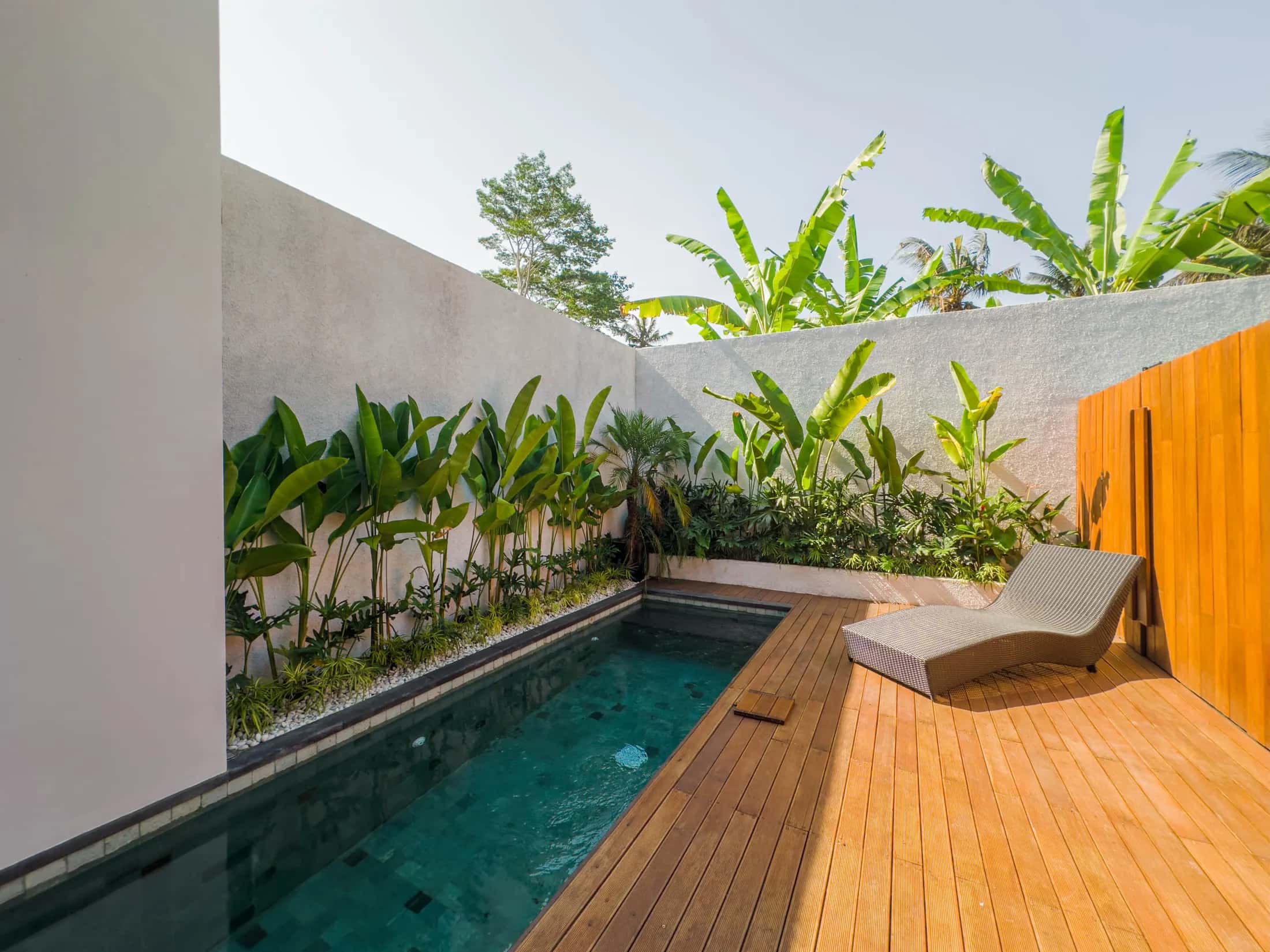 Honeymoon bed setup with rose petals and swan towels at Tannari Villas